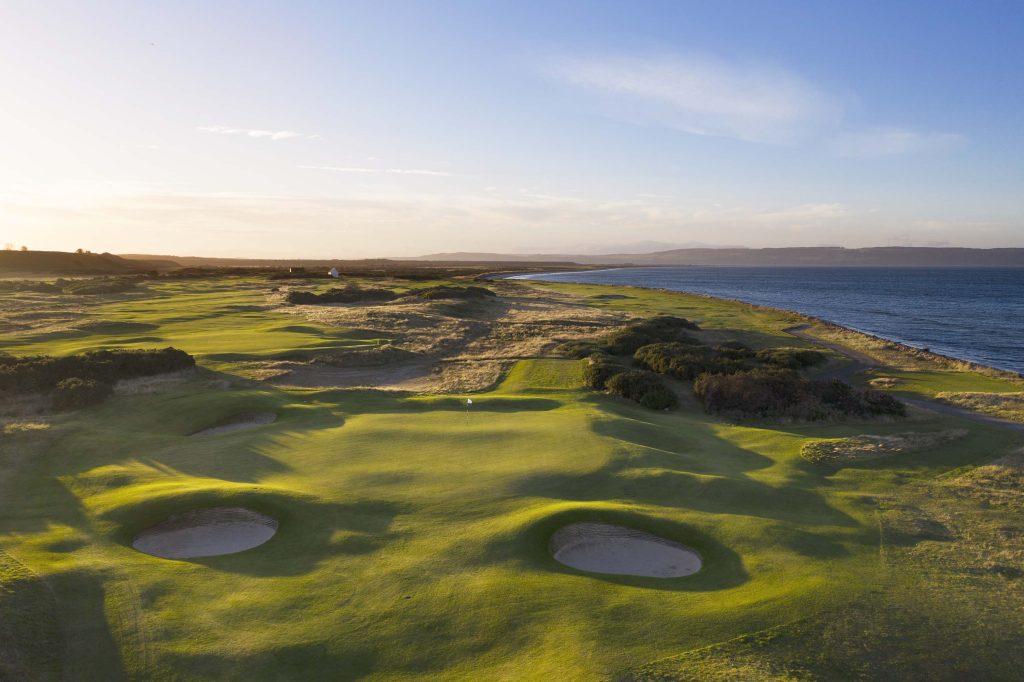 Aerial view of Nairn Golf Club, located along the coastline