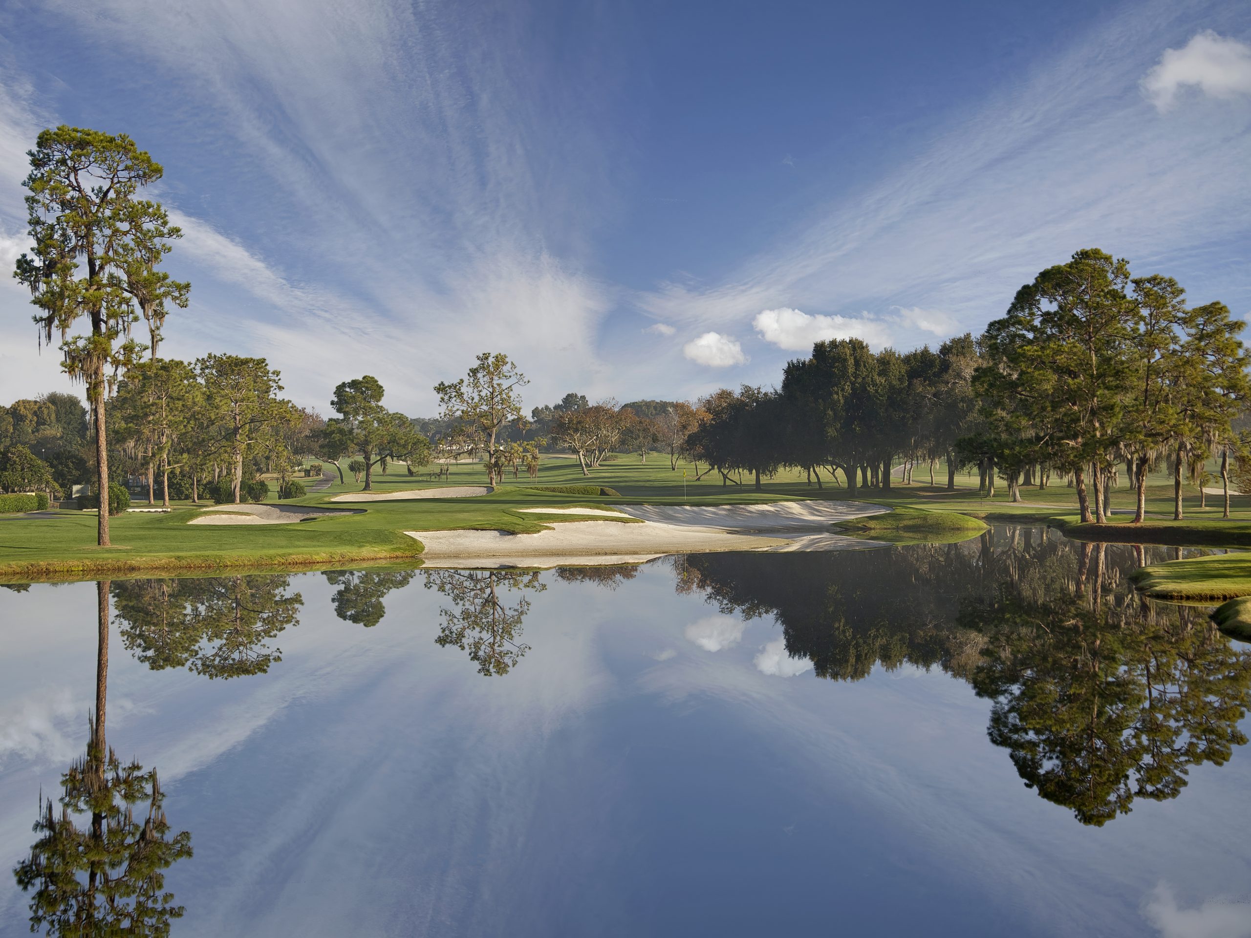 A lake at Arnold Palmers Bay Hill Club & Lodge with the course in the distance