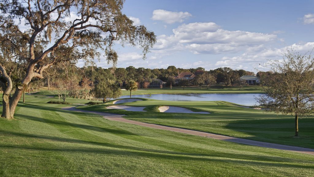 Lush green treelined fairways, looking out over the lakes of Arnold Palmers Bay Hill