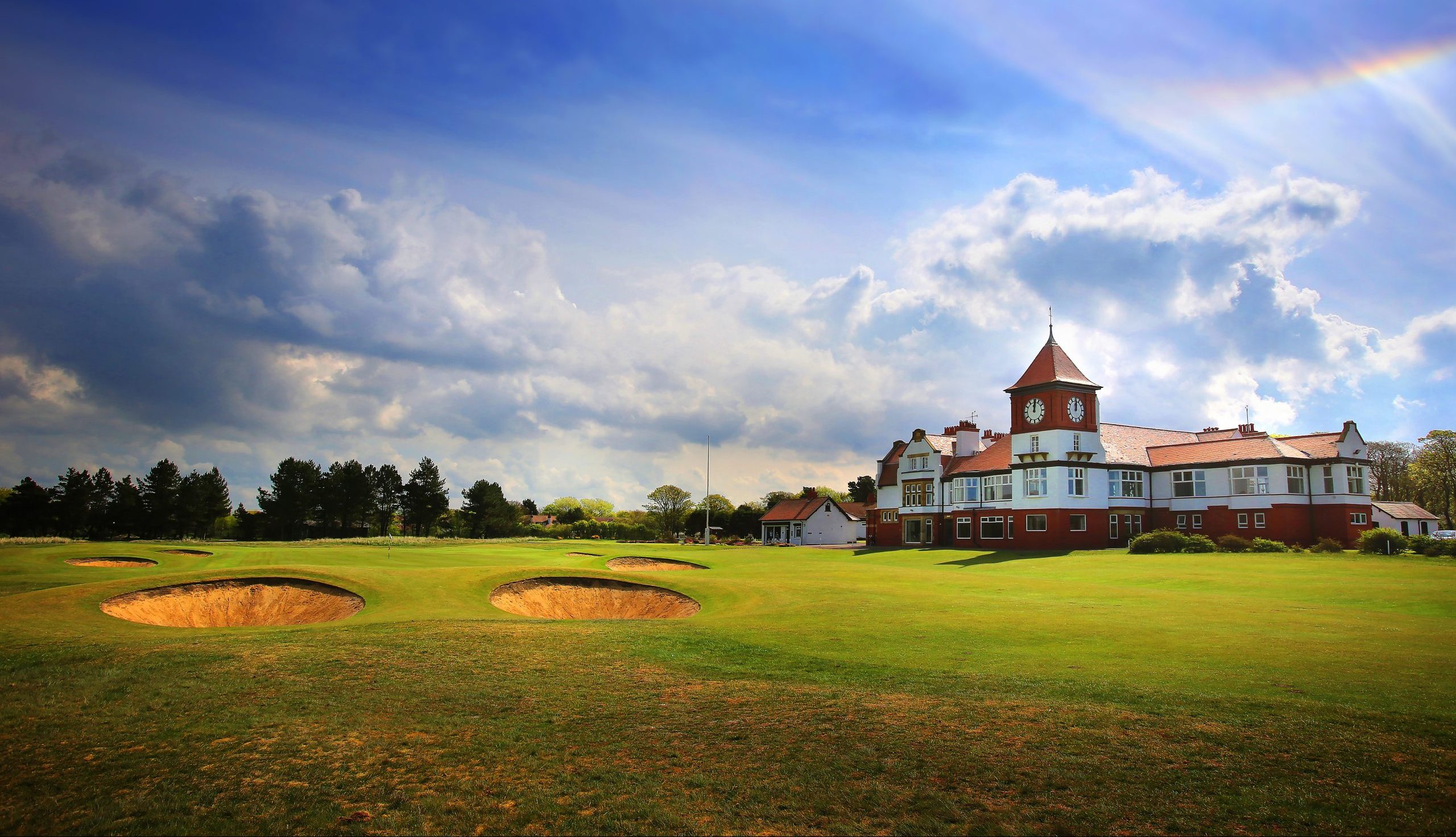 Formby Golf Clubs' redbrick clubhouse sitting behind the 18th Green