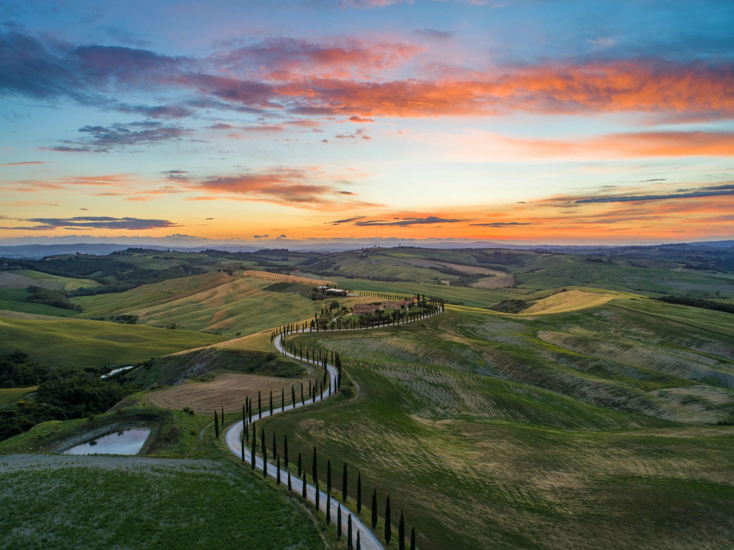 Sunset over the lush green Tuscan countryside