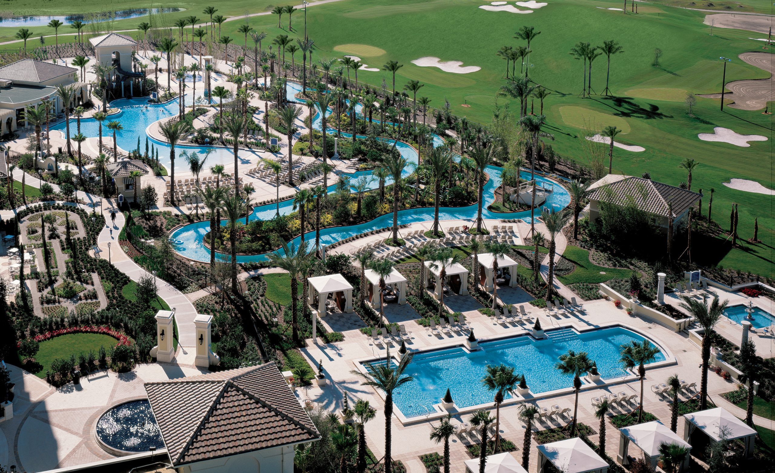 Intricate palm tree lined pool complex of Orlando Omni resort