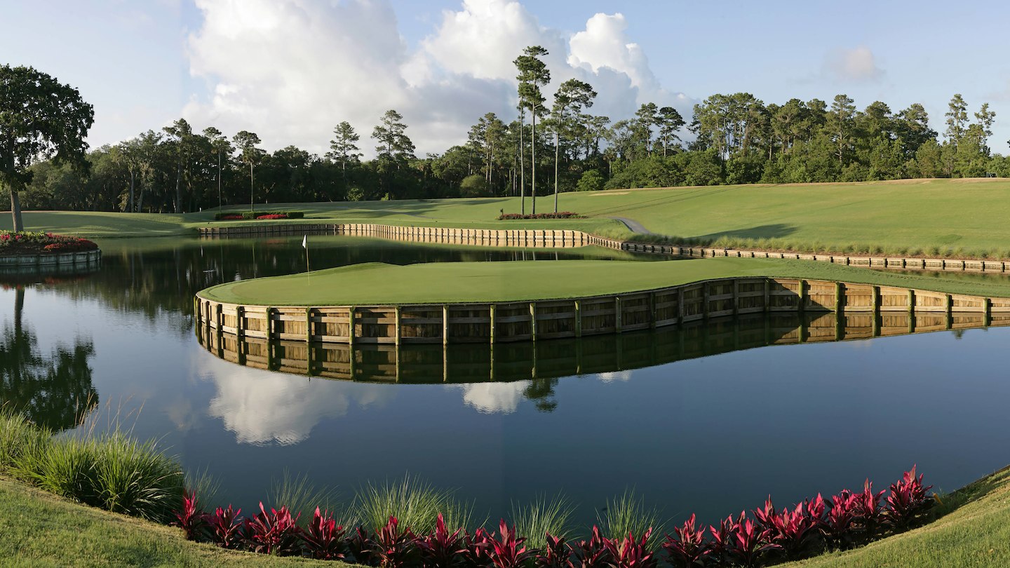 The Island Green at TCP Sawgrass with reflections of blue sky in the lake