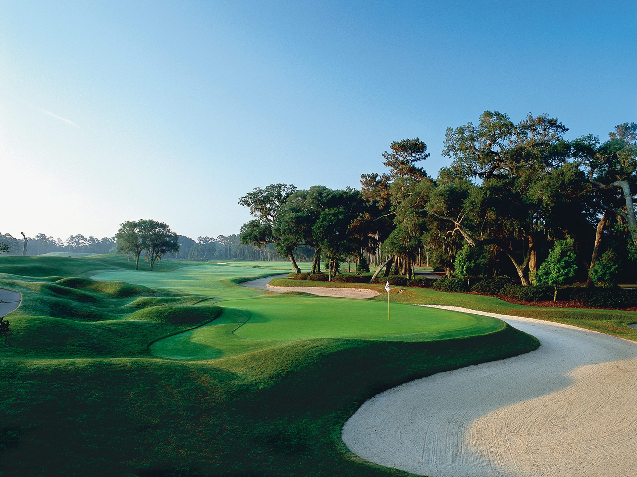 Blue skies, lush green fariways and pure white sand at TPC Sawgrass