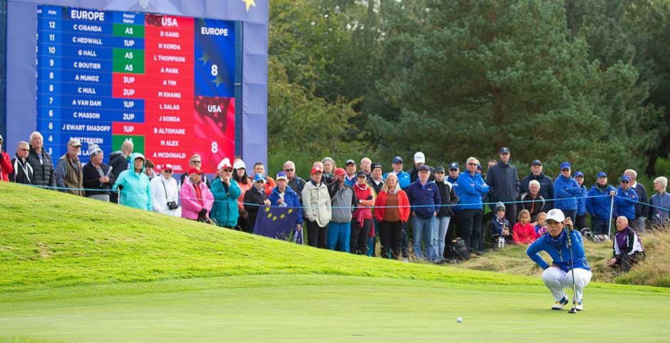 Solheim Cup fans watching a player on the green