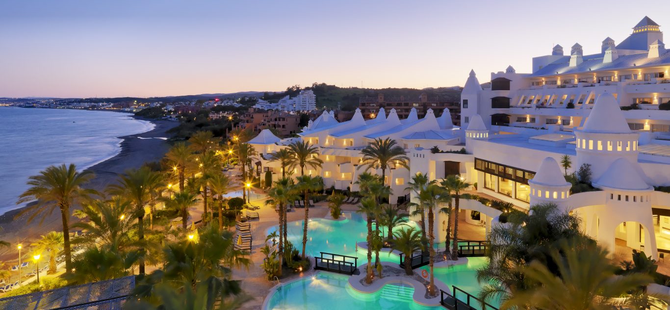 Beach and pool area at night at the H10 Estepona Palace, Marbella, Spain