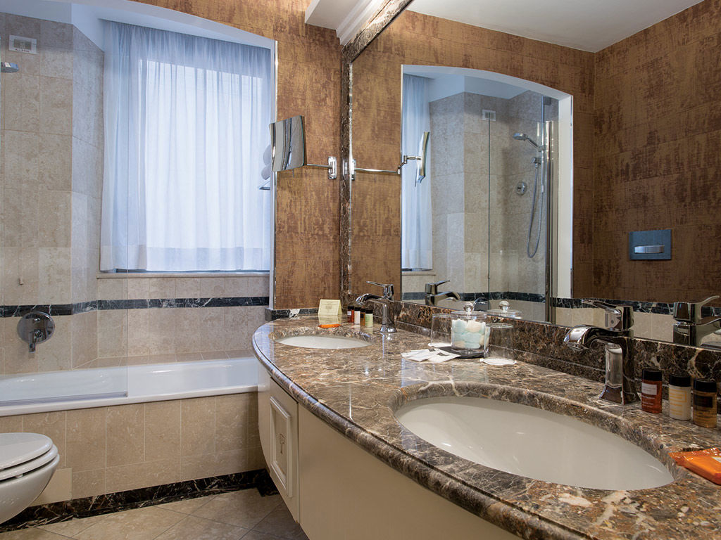 Marble bathroom suite with double sink at Hotel Dei Melini, Rome