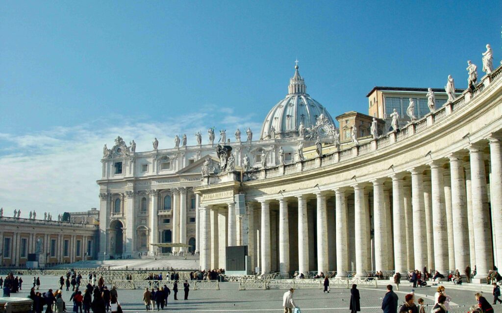Tourists wondering around St Peters Square at the Vatican, Rome, Italy
