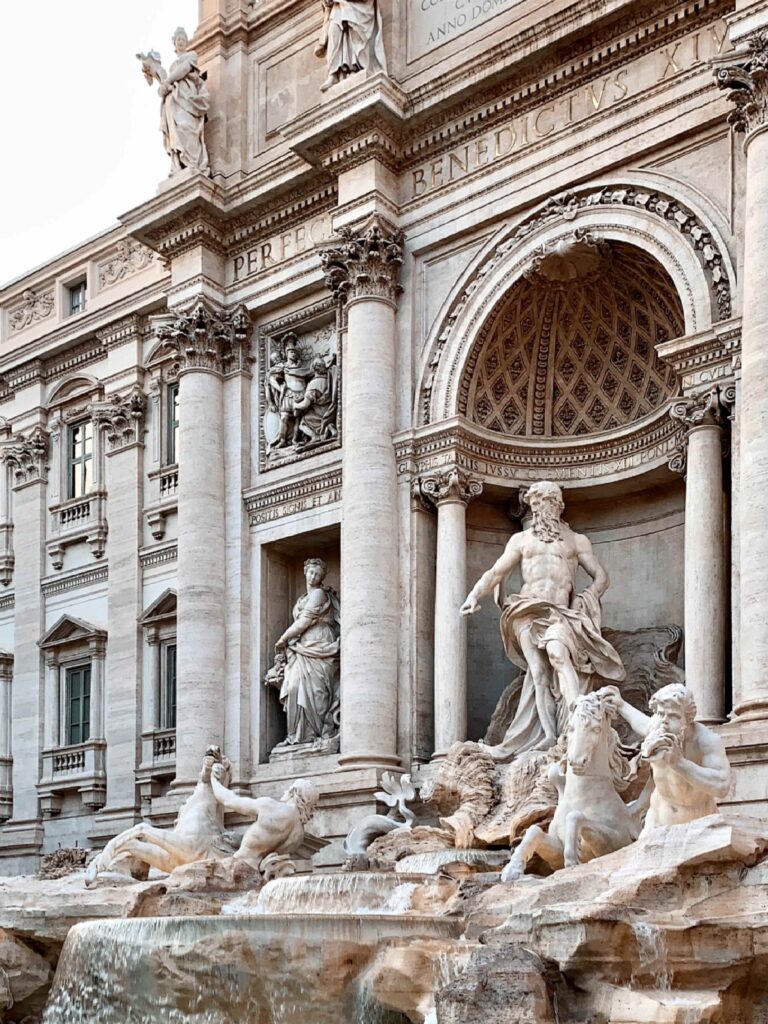 A statue of Neptune in the Trevi fountain