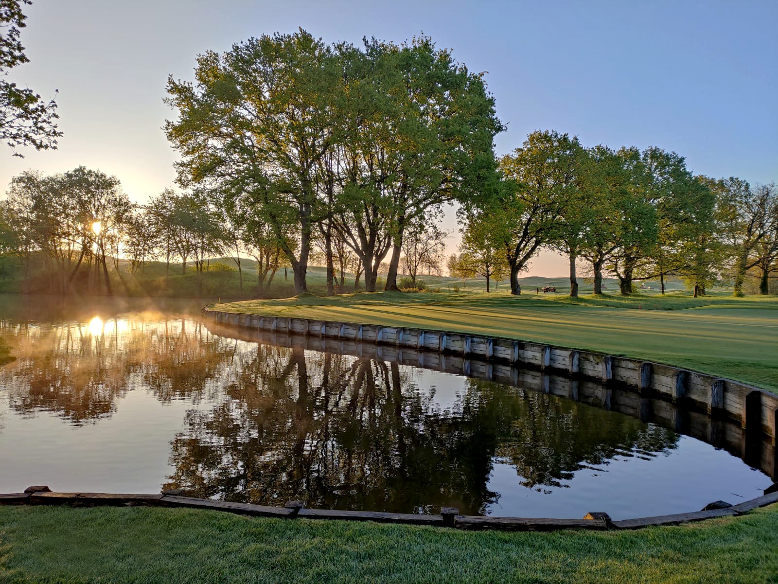 Sunrise over water at Le Golf National, Paris, France